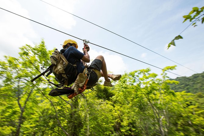 Jaco Jungle Zipline & Waterfall Tractor Tour - Riding the tractor into the private valley