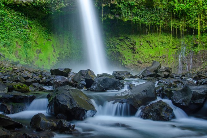 Water falling into a jungle pool below Arenal, La Fortuna
